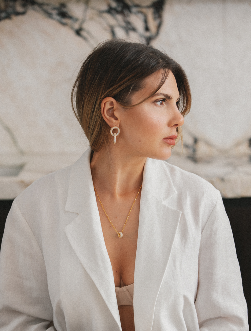 Woman wearing Gina Earrings and Eden Necklace from the handmade sterling silver jewelry collection