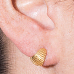 model wearing tilly earrings in gold