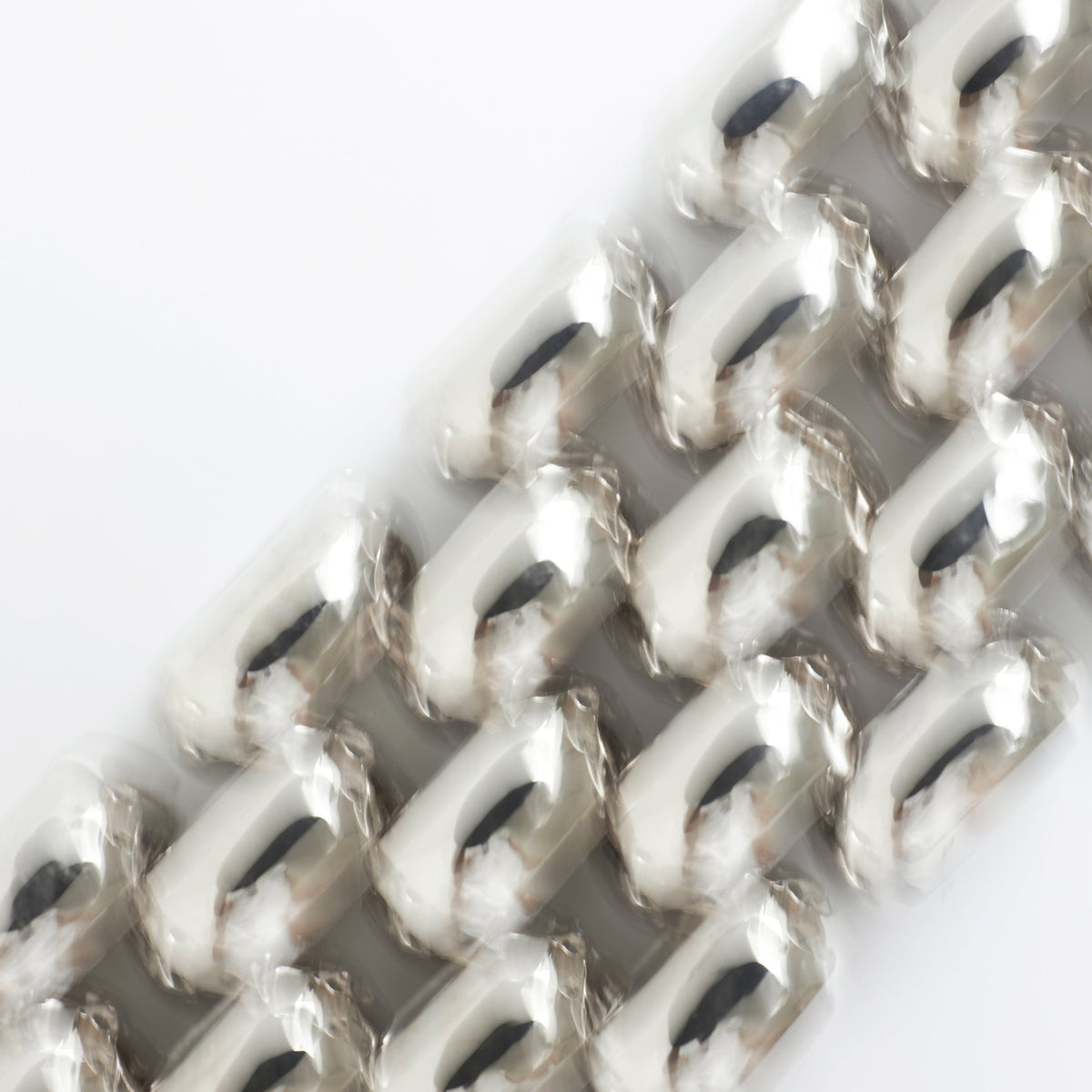 Exquisite jewelry gifts under 300 euros featuring a close-up of sculptural silver rings.