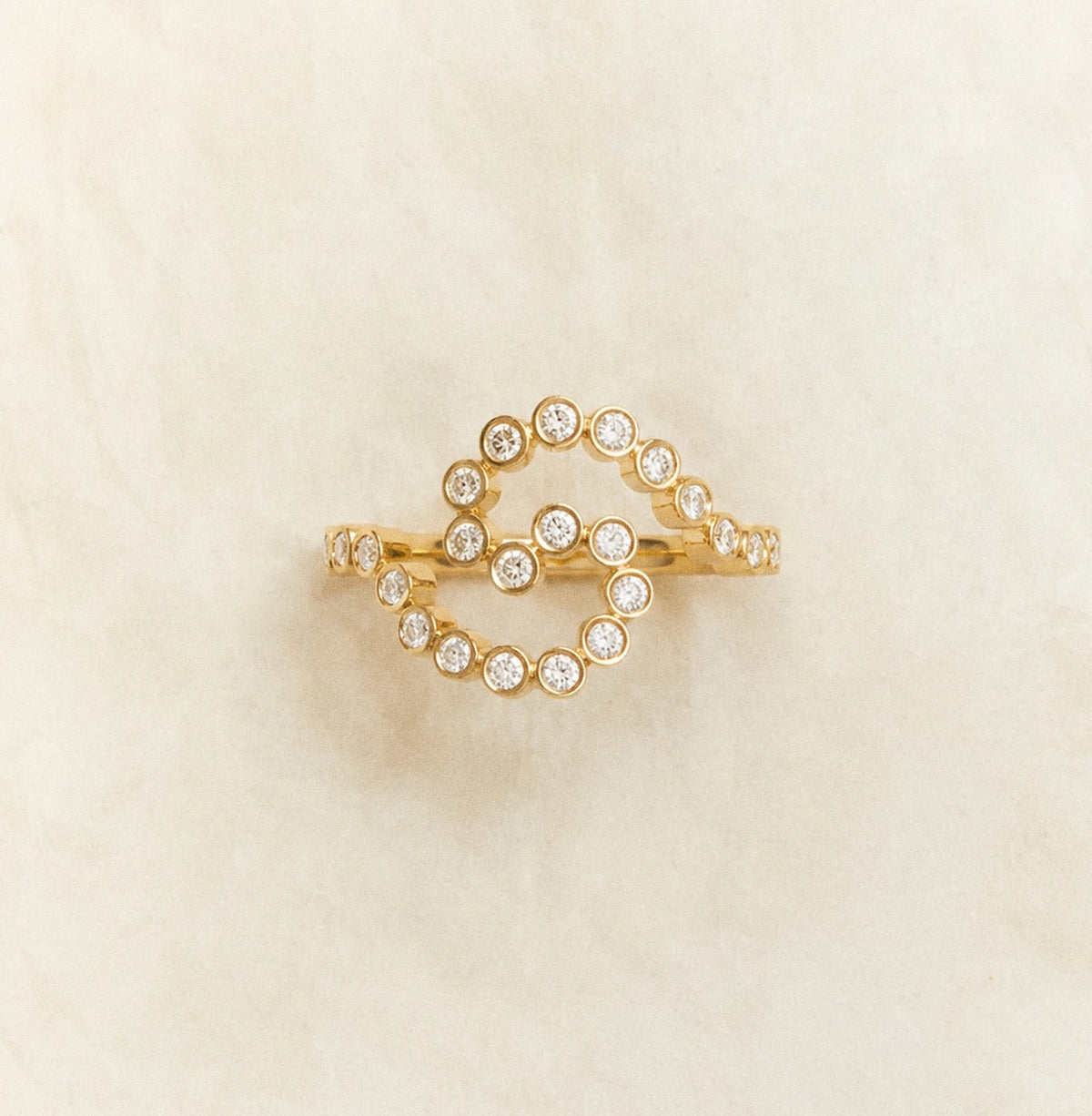 Gold ring with circular design and crystals, part of the bride squad jewelry gifts collection.