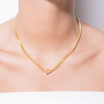 model wearing alphabet necklace with pendant P in gold