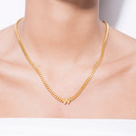 model wearing alphabet necklace with pendant W in gold