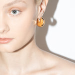 model wearing bailey earrings in gold