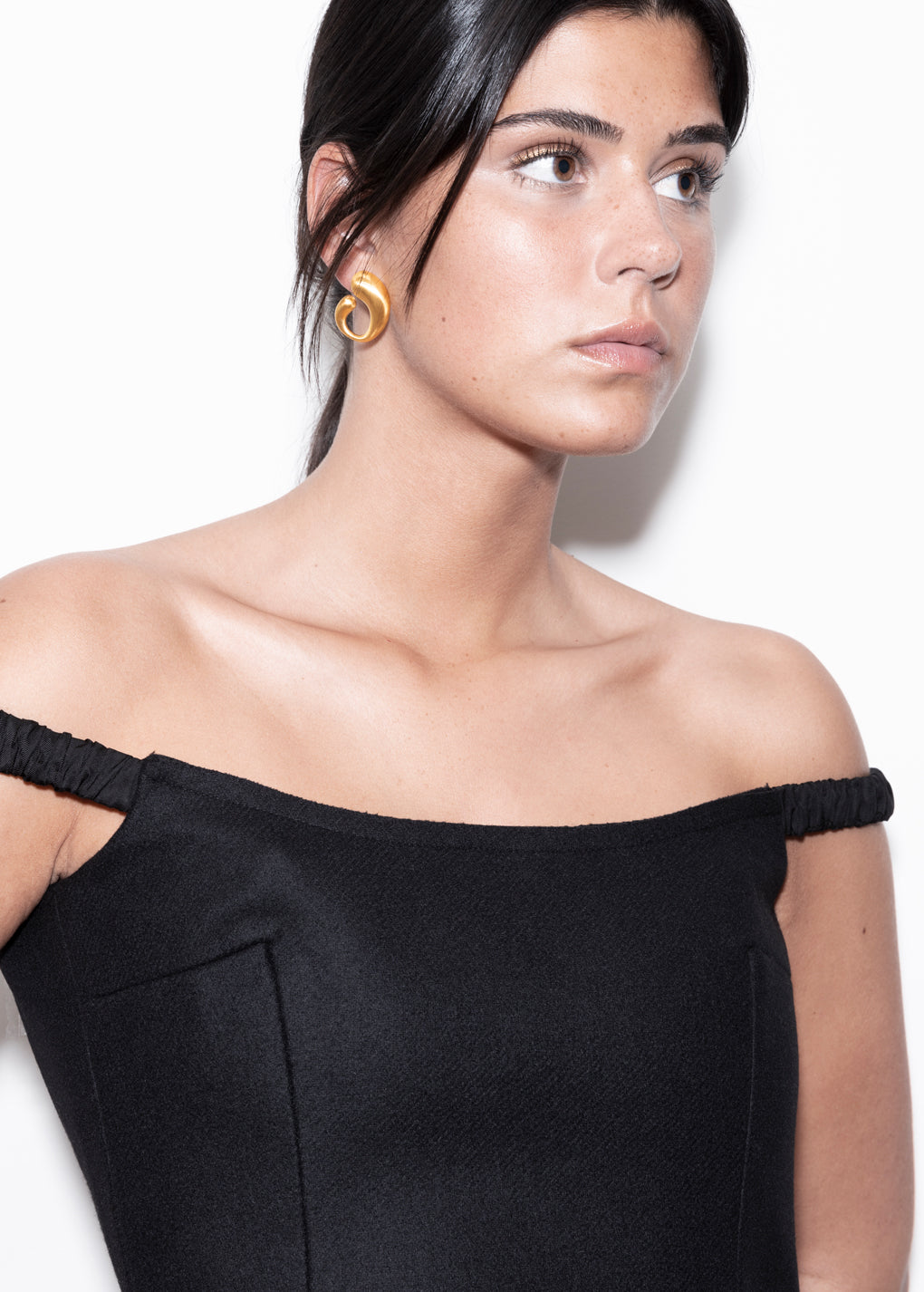 model wearing camille earrings in gold