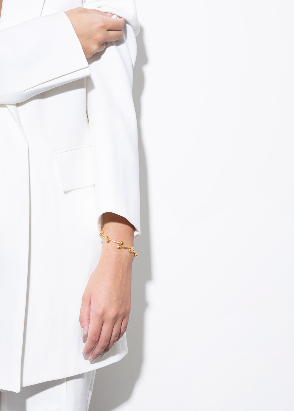 model wearing elin bracelet in gold