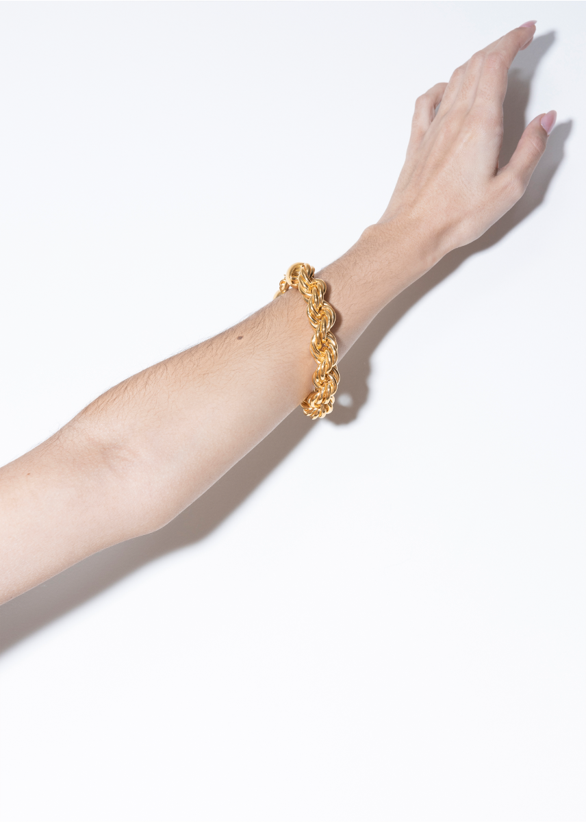 model wearing goliath bracelet in gold