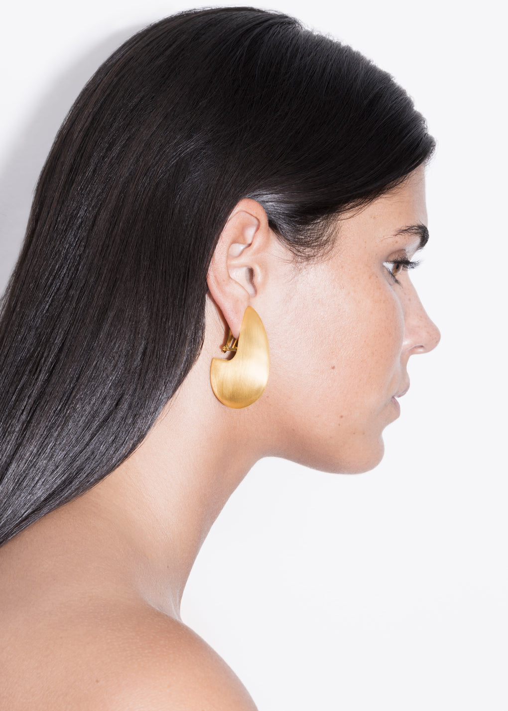 model wearing pam earrings in gold