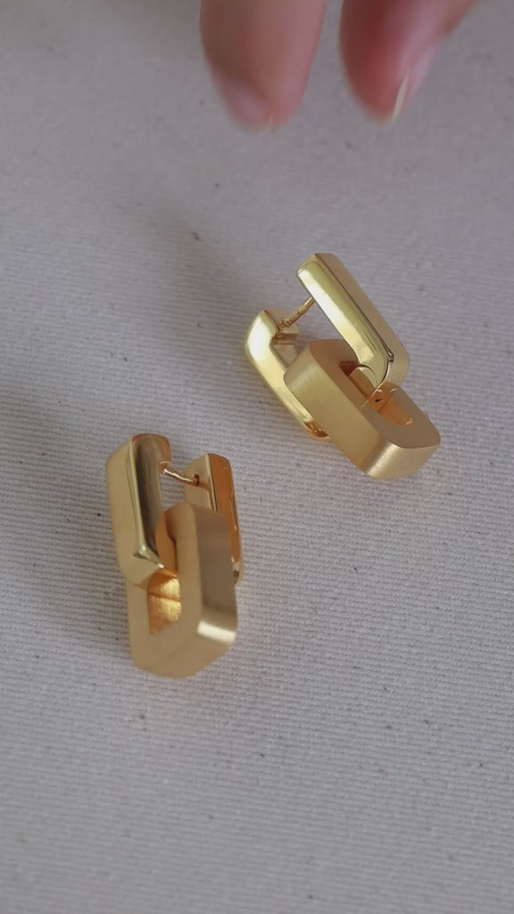 Model using fiona double earrings in gold 