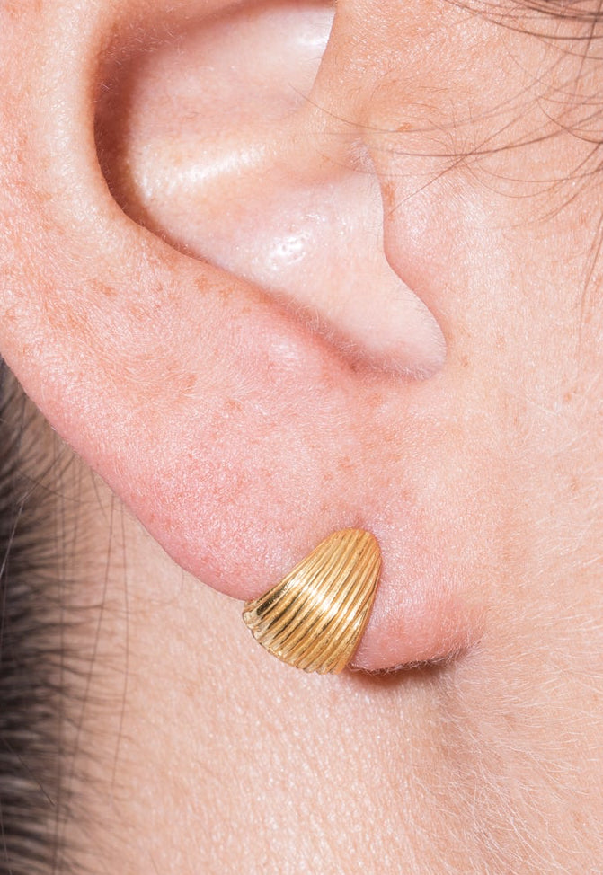 model wearing tilly earrings in gold